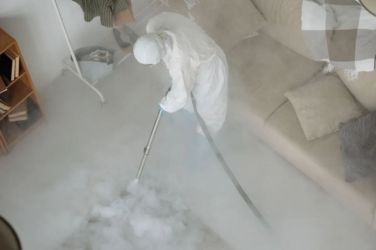Biohazard cleanup technician in protective equipment, June Park, FL